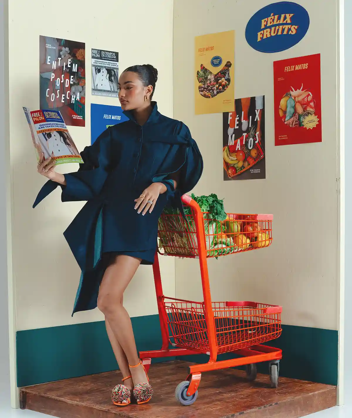 Zarcillo Dress – Editorial Front View Editorial front view of a model wearing the Felix Matos Zarcillo Dress in deep blue with sculptural sleeves and asymmetrical panel construction.