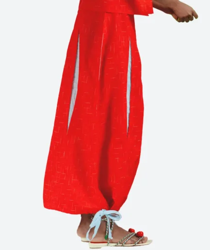 Product detail view of the Felix Matos Arilo Skirt featuring a red long silhouette with side openings and light blue contrast accents.