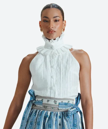 Product detail view of the Felix Matos Azahar Top featuring a white sleeveless pleated design with a high ruffle collar and covered buttons.