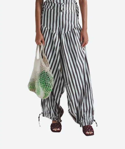 Product detail view of the Felix Matos Espiga Pants featuring brown and white vertical stripes, wide-leg volume and gathered hem details.