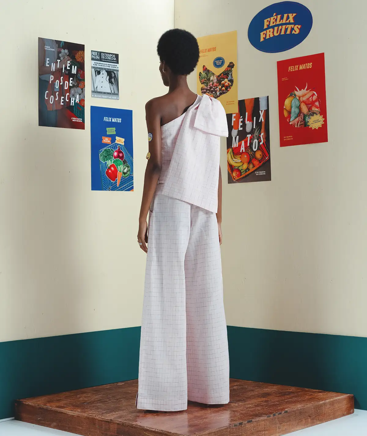 Huerto Set – Editorial Back View Editorial back view of a model wearing the Felix Matos Huerto Set with a pale pink asymmetrical top and matching wide-leg pants.