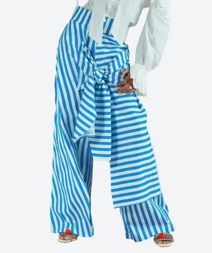 Detail view of the Felix Matos RIO Pants featuring blue and white vertical stripes with a front tie overlay.