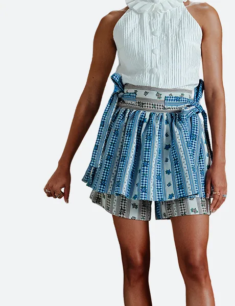 Skirts category look view for Felix Matos featuring a printed layered skirt with coordinated shorts and a white blouse.