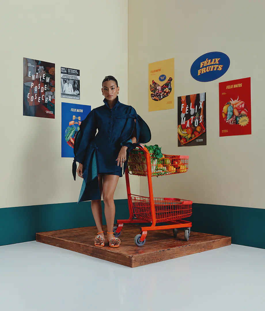Felix Matos slider image featuring the Zarcillo Dress in deep blue with sculptural sleeves and asymmetrical panel details.
